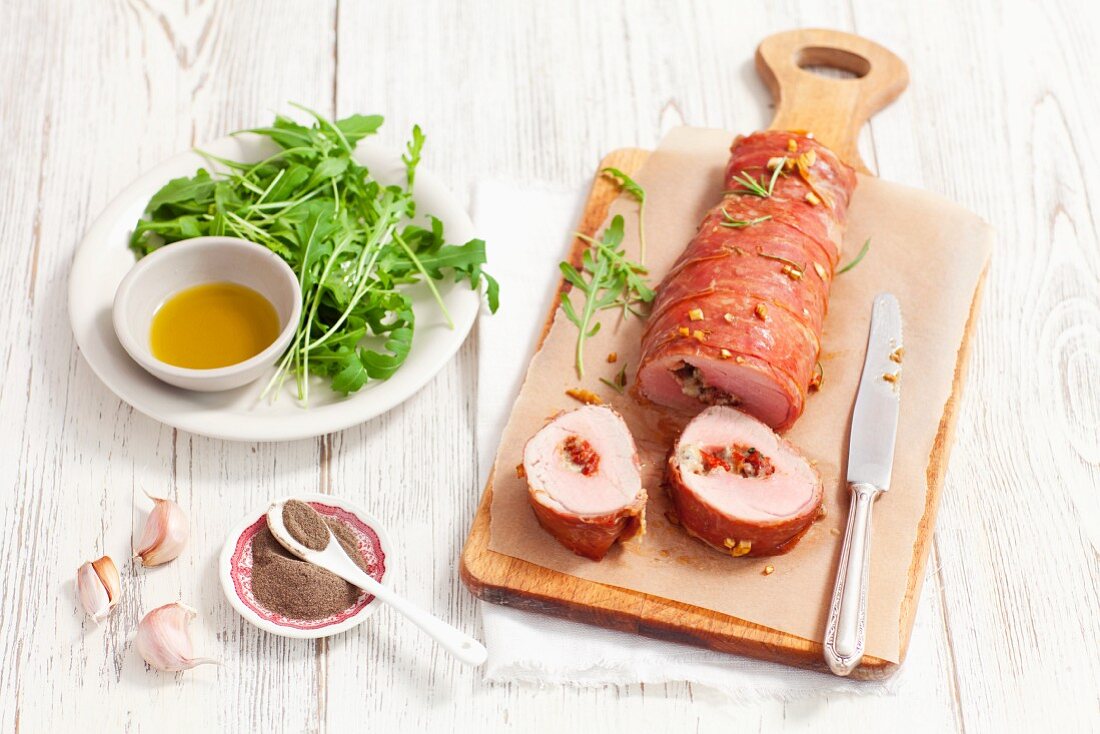 Stuffed pork fillet with dried tomatoes and gorgonzola wrapped in Proscuitto