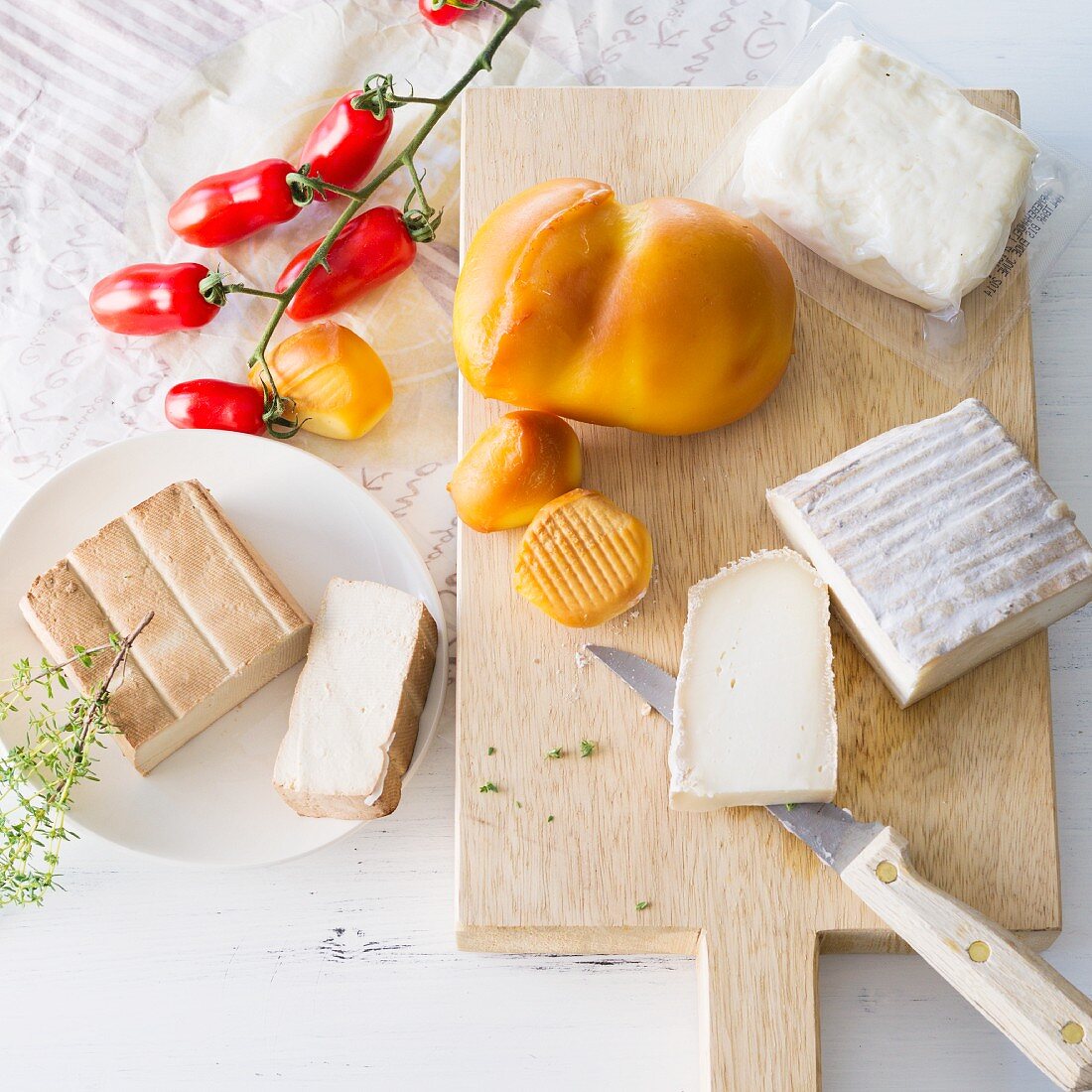 An arrangement of cheese featuring halloumi, scamorza, goat's cheese and smoked tofu