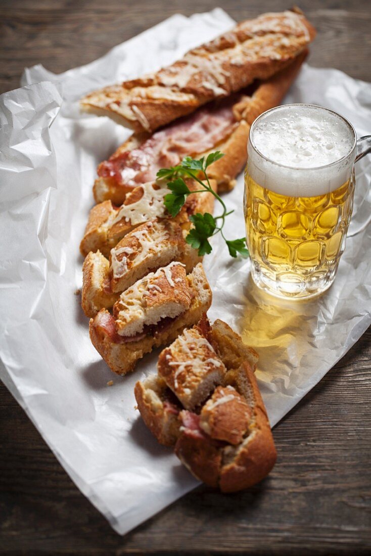 Gratinated baguette filled with cheese and bacon