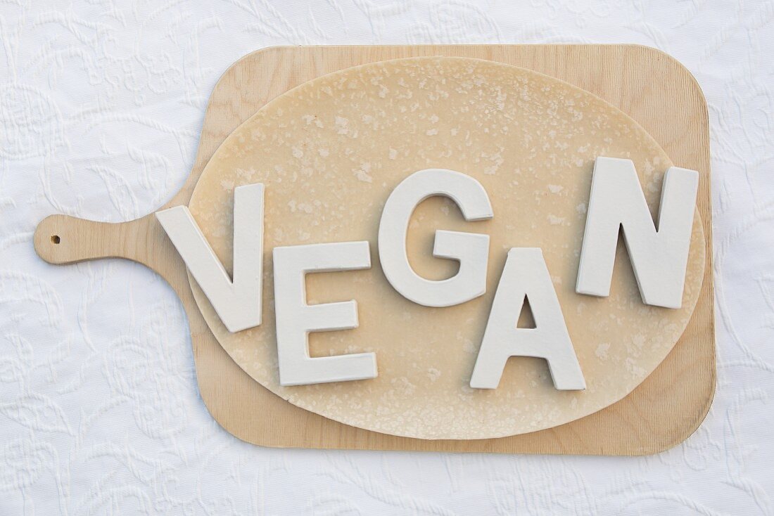 The word 'Vegan' spelt out on pizza dough