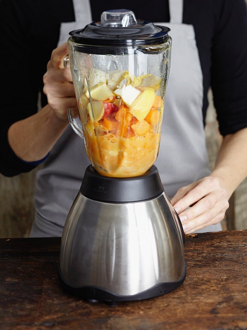 Fruit being puréed in a mixer