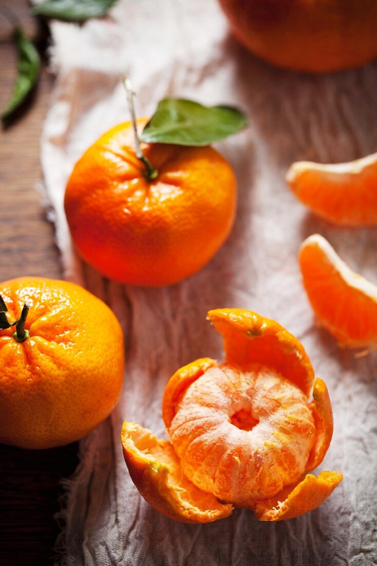 Mandarin oranges, one peeled