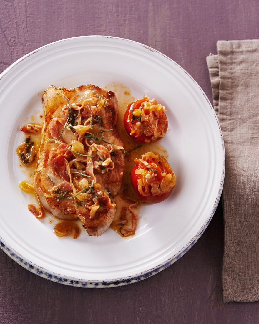 Iberian pork steak with stuffed tomatoes