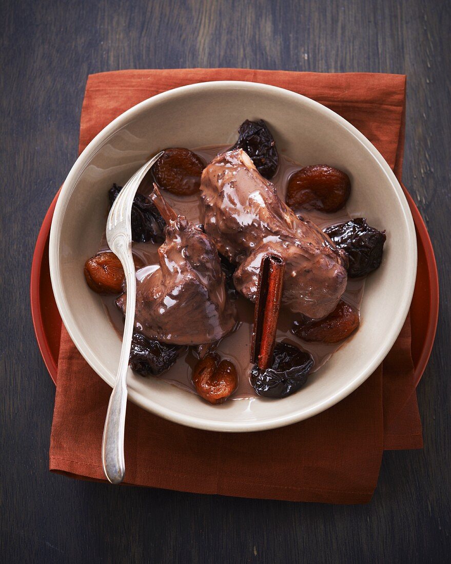 Rabbit with dried fruits and cinnamon in a red wine sauce