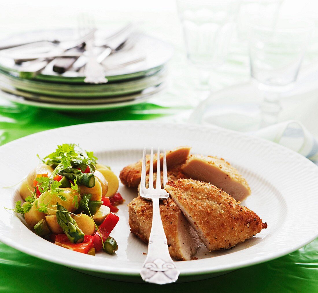 Crispy chicken breast with potato and asparagus salad
