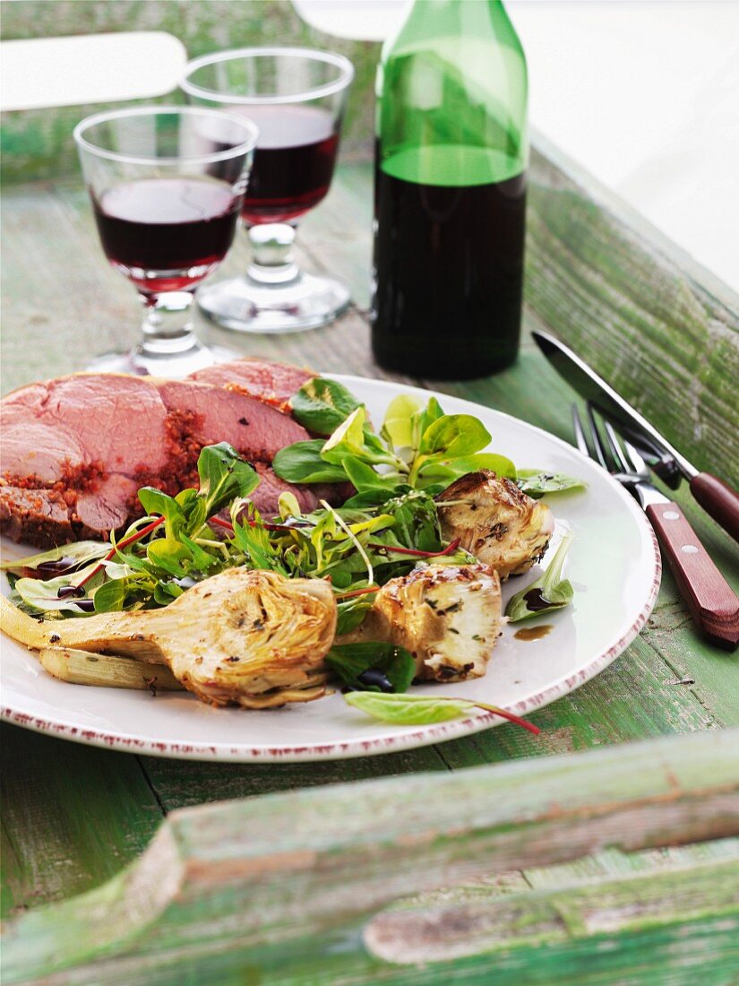 Roast lamb with lamb's lettuce and artichokes