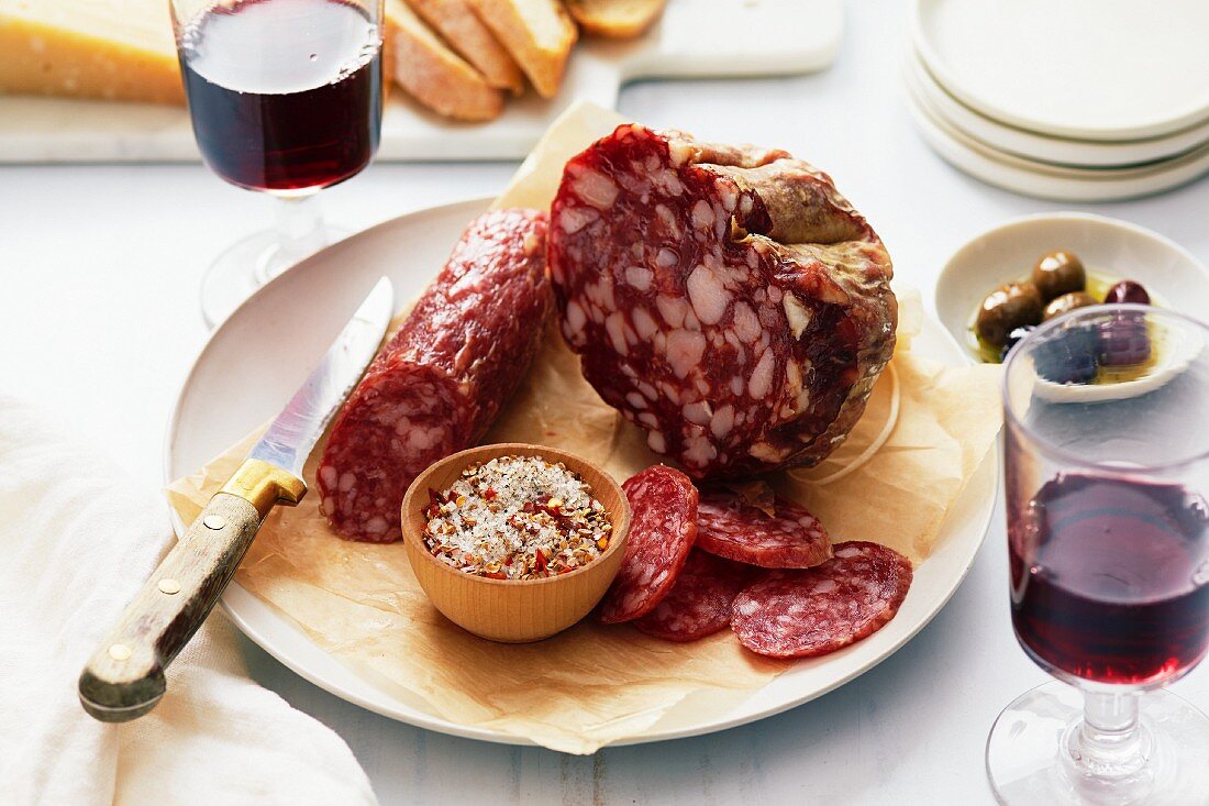 Salami with a spice mixture, red wine and olives