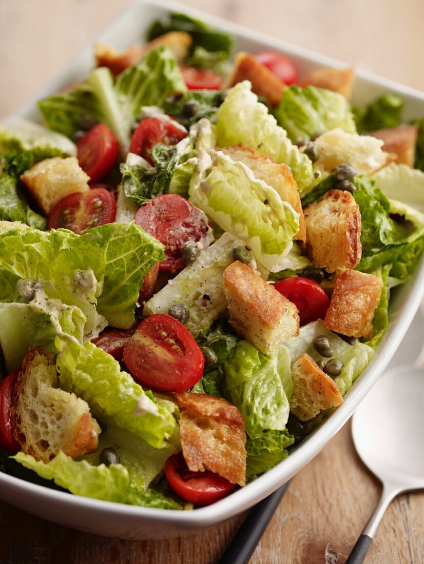 Caesar salad with tomatoes and croutons