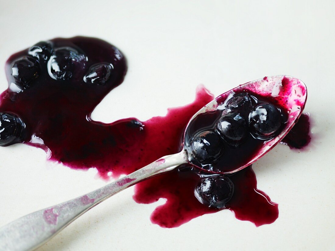 Blueberry sauce with a spoon