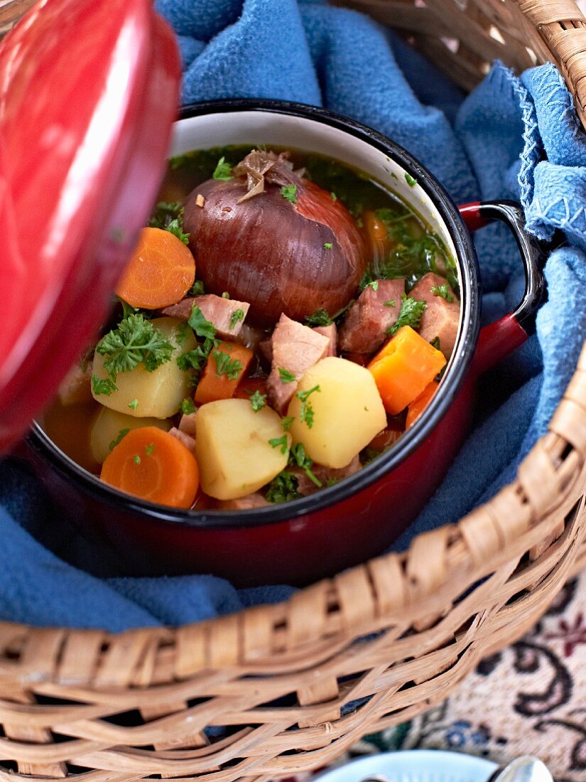 Hearty autumnal soup with pork and vegetables