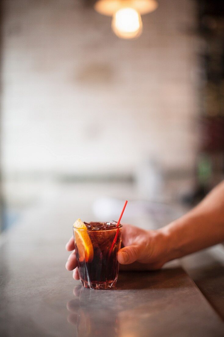 A Negroni cocktail on a bar