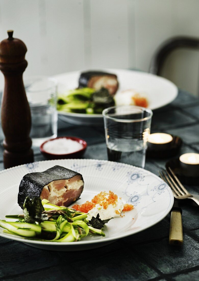 Fish terrine wrapped in a nori leaf with a green asparagus salad, horseradish cream and caviar