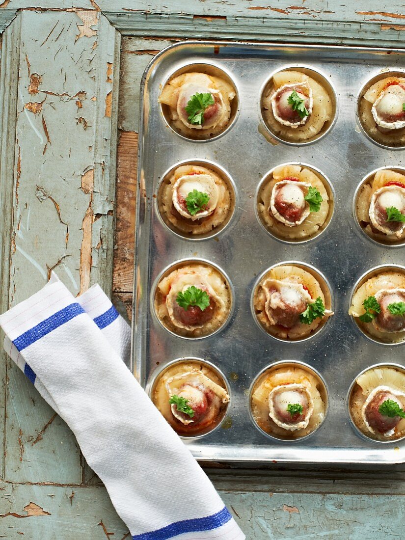 Meatballs with pineapple topped with goats cheese