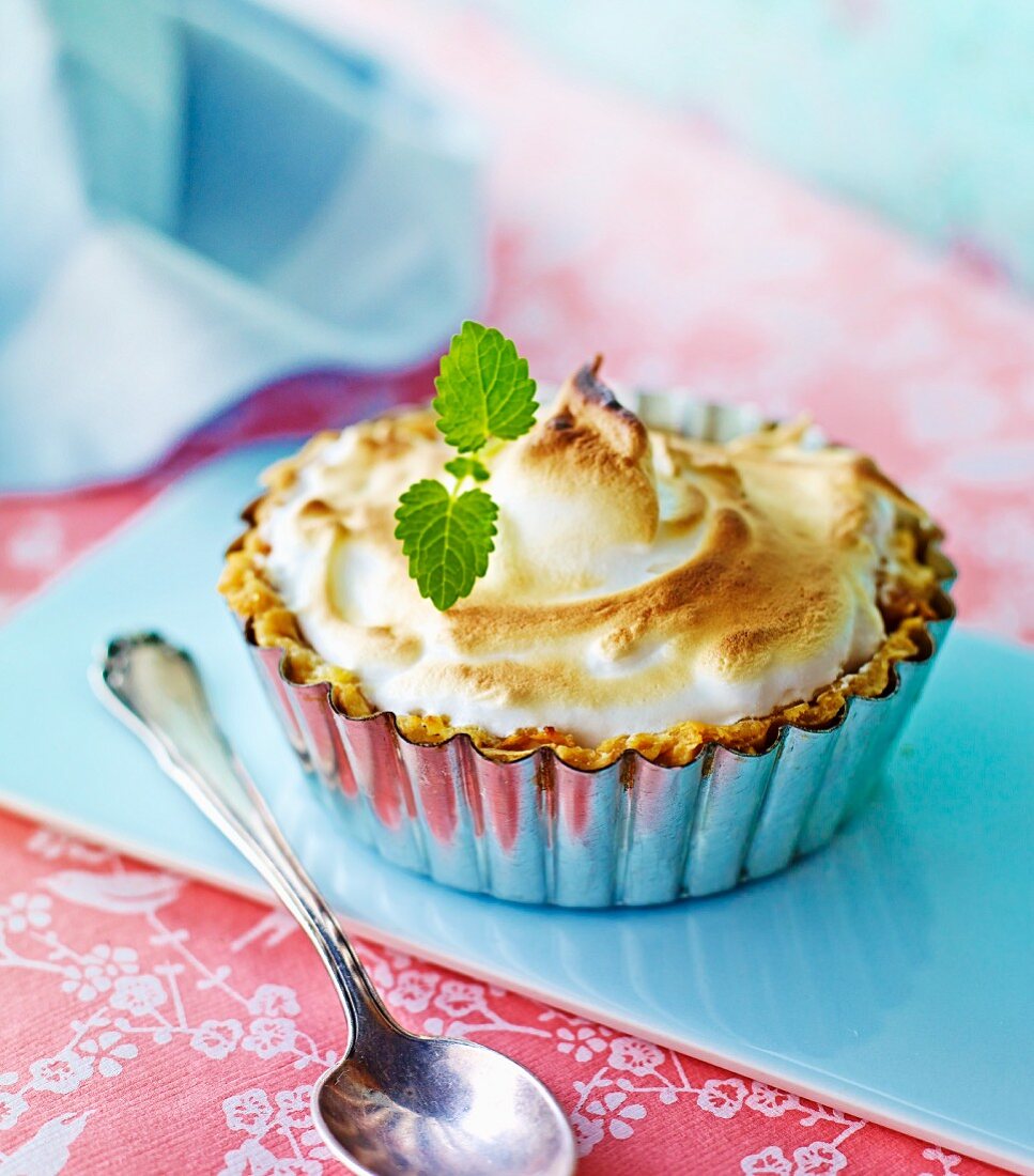 A berry tartlet topped with meringue