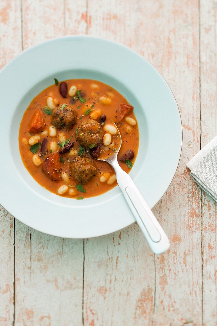 Spicy bean stew with meatballs and chorizo