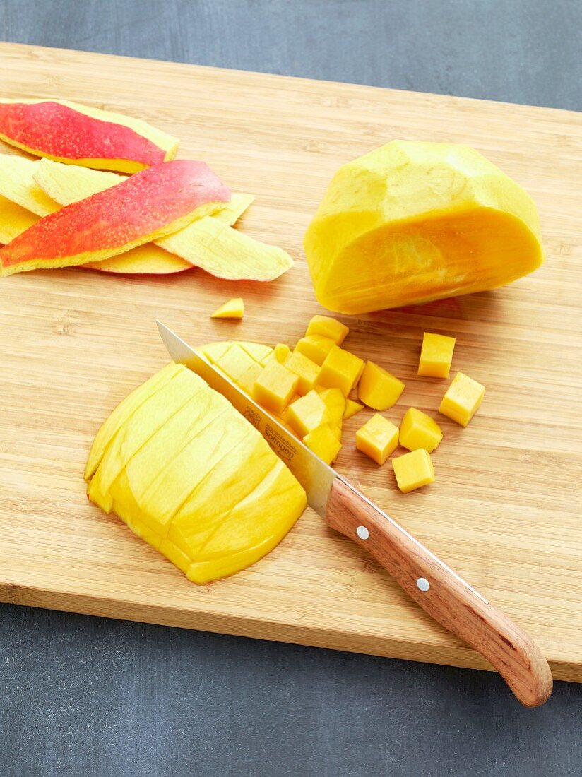 A mango being diced