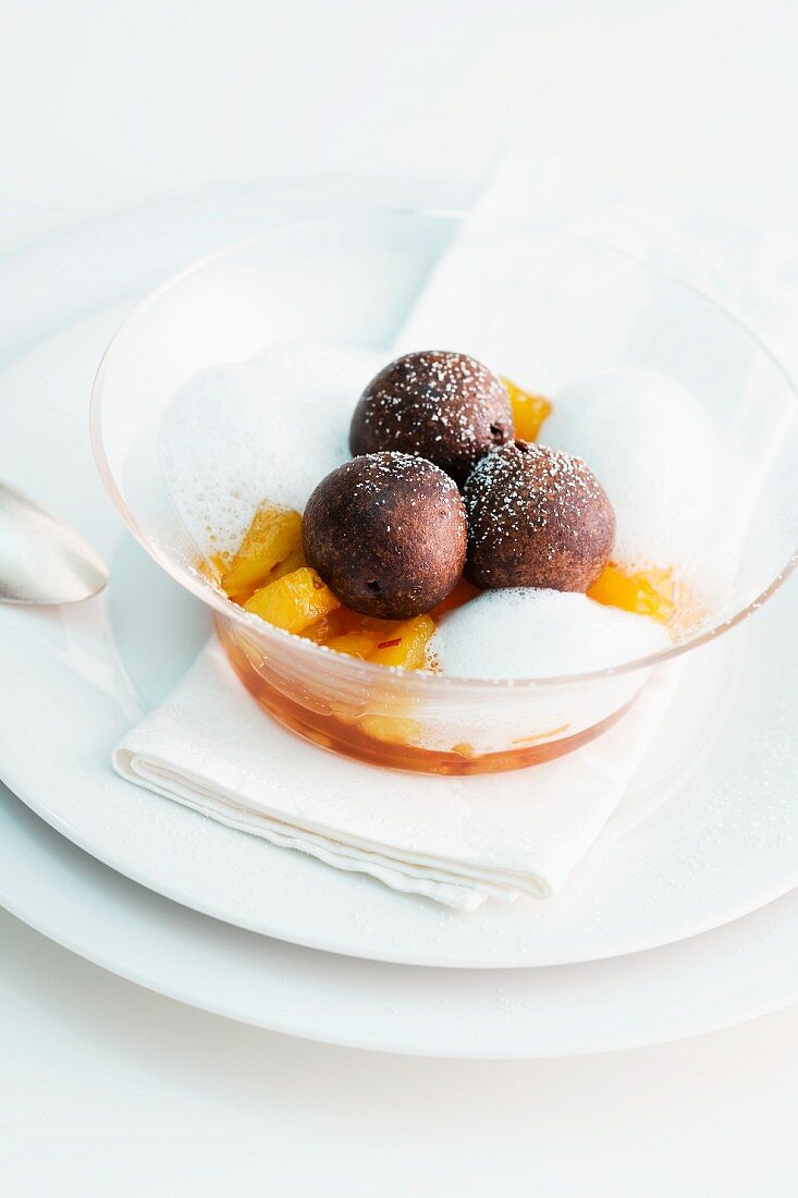 Chocolate truffles on a peach salad