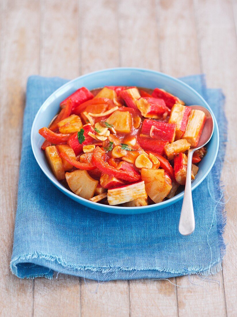 Surimi with garlic, pepper and pineapple in a tomato sauce