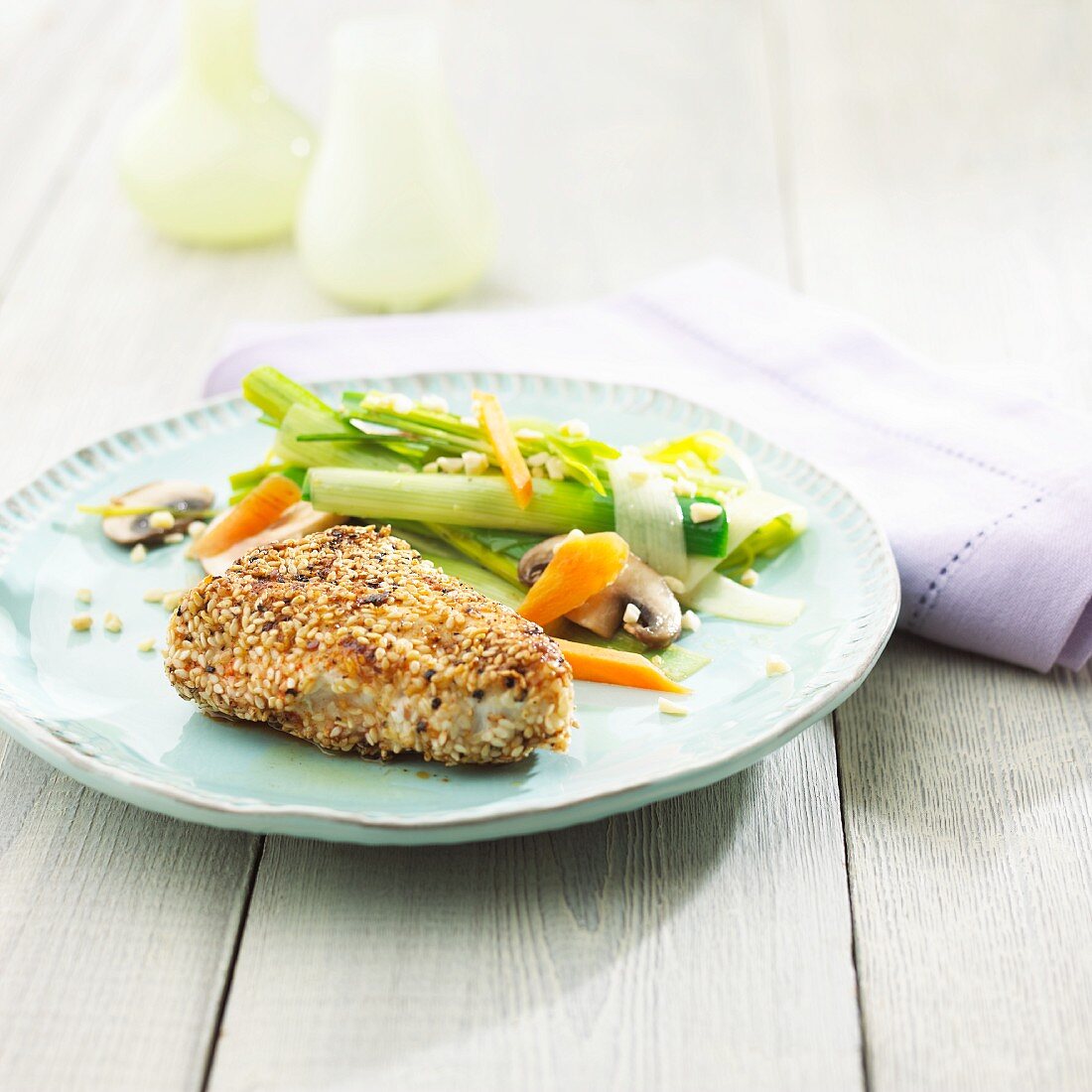 Chicken breast fillet with a sesame seed coating with a delicate leek medley