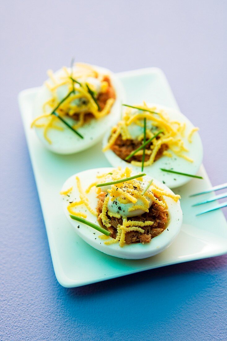 Devilled eggs filled with cheese and chives