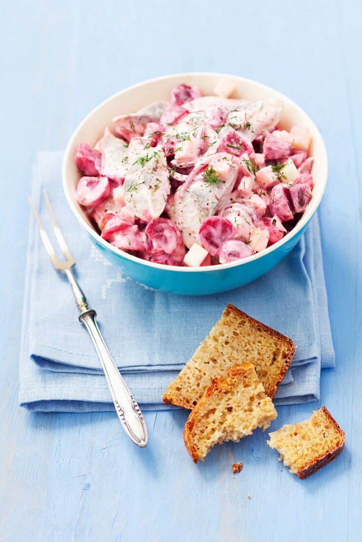 Herring salad with beetroot, apple, red onions and mayonnaise