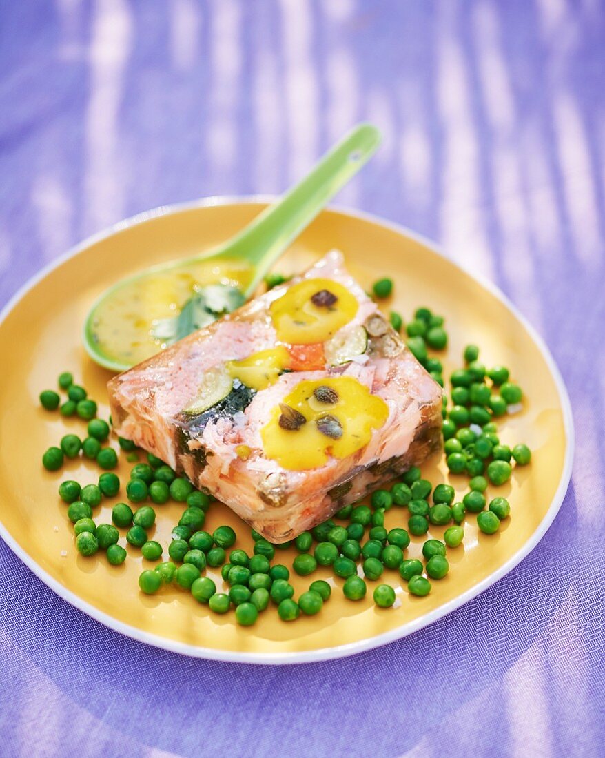 Salmon terrine on a bed of peas with a caper sauce