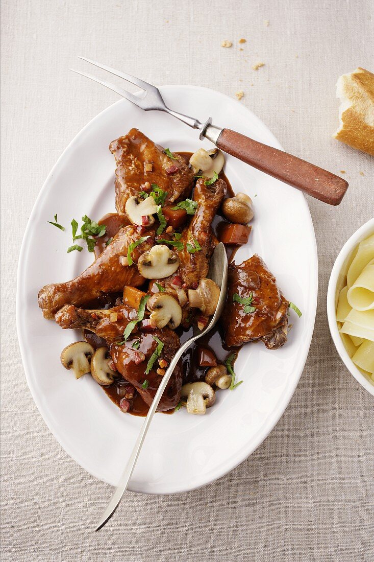 Coq au vin on an oval plate