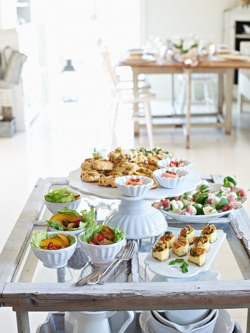 A fingerfood buffet on a rustic glass table