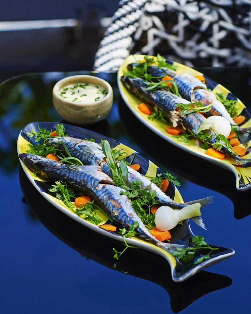 Blue mackerel on a bed of herbs with a mint and butter sauce