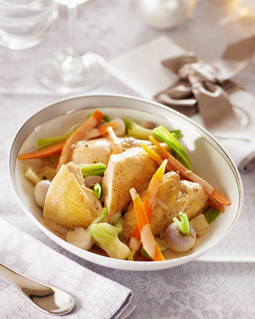 Spring chicken with vegetables in a white wine sauce