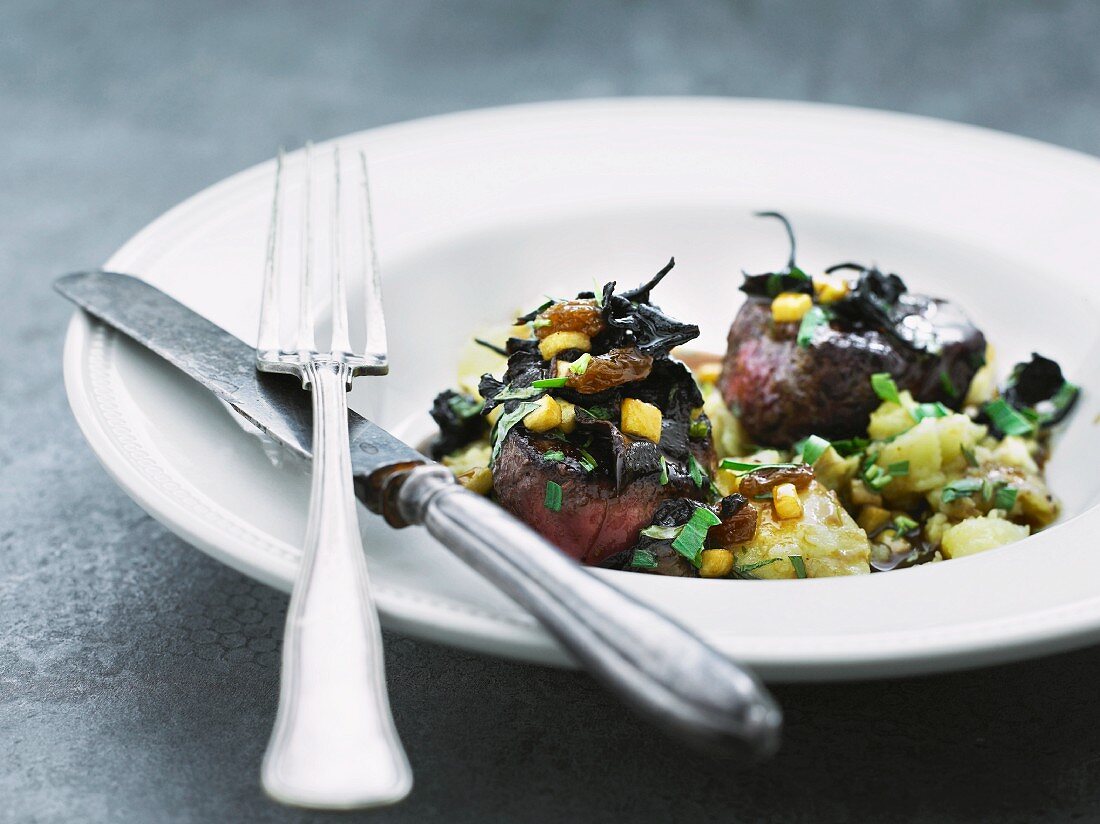 Venison medallions with dark chocolate, orange and port wine gravy