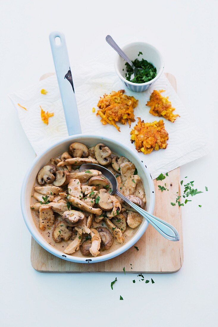 Turkey with mushrooms and carrot and sweetcorn cakes