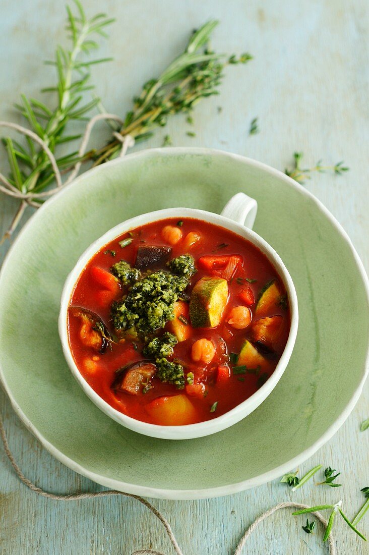 Summer vegetable soup with basil pesto