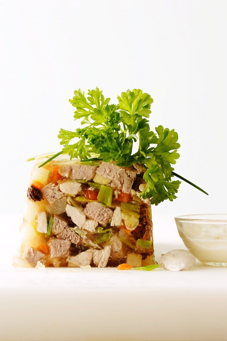 Meat and vegetables in aspic with parsley