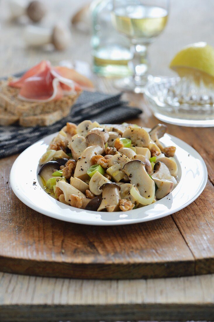 Marinated mushrooms with walnuts and Parma ham