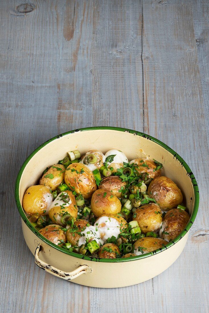 Roasted new potatoes with capers and melted cheese