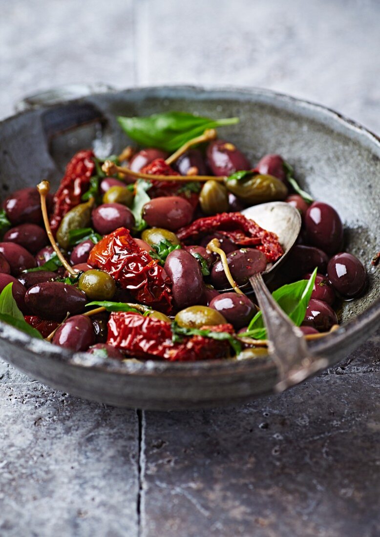 Marinated olives with dried tomatoes and capers