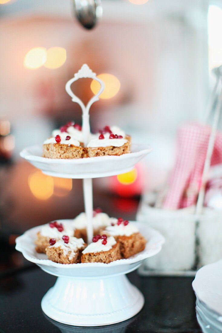 Pieces of cake on white china cake stand