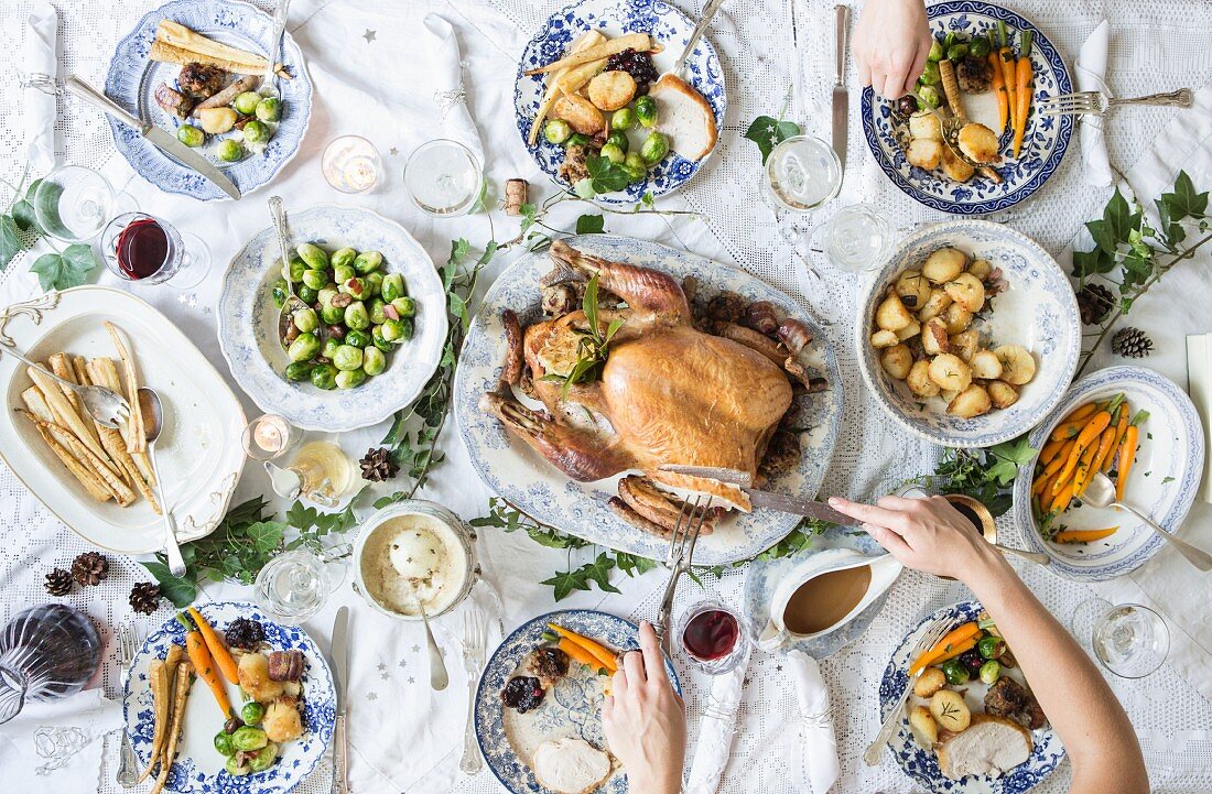 Christmas dinner with turkey, parsnips, Brussels sprouts, potatoes, carrots, gravy and cranberry sauce