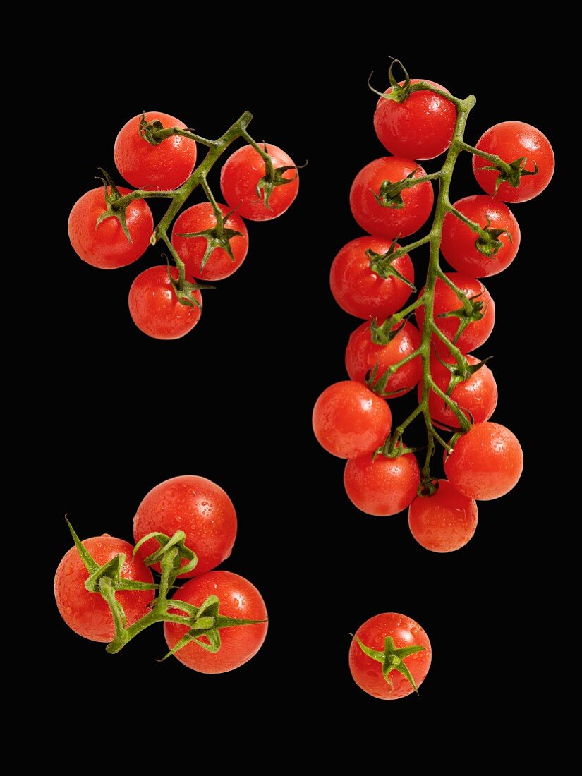 Cherry tomatoes on a black surface