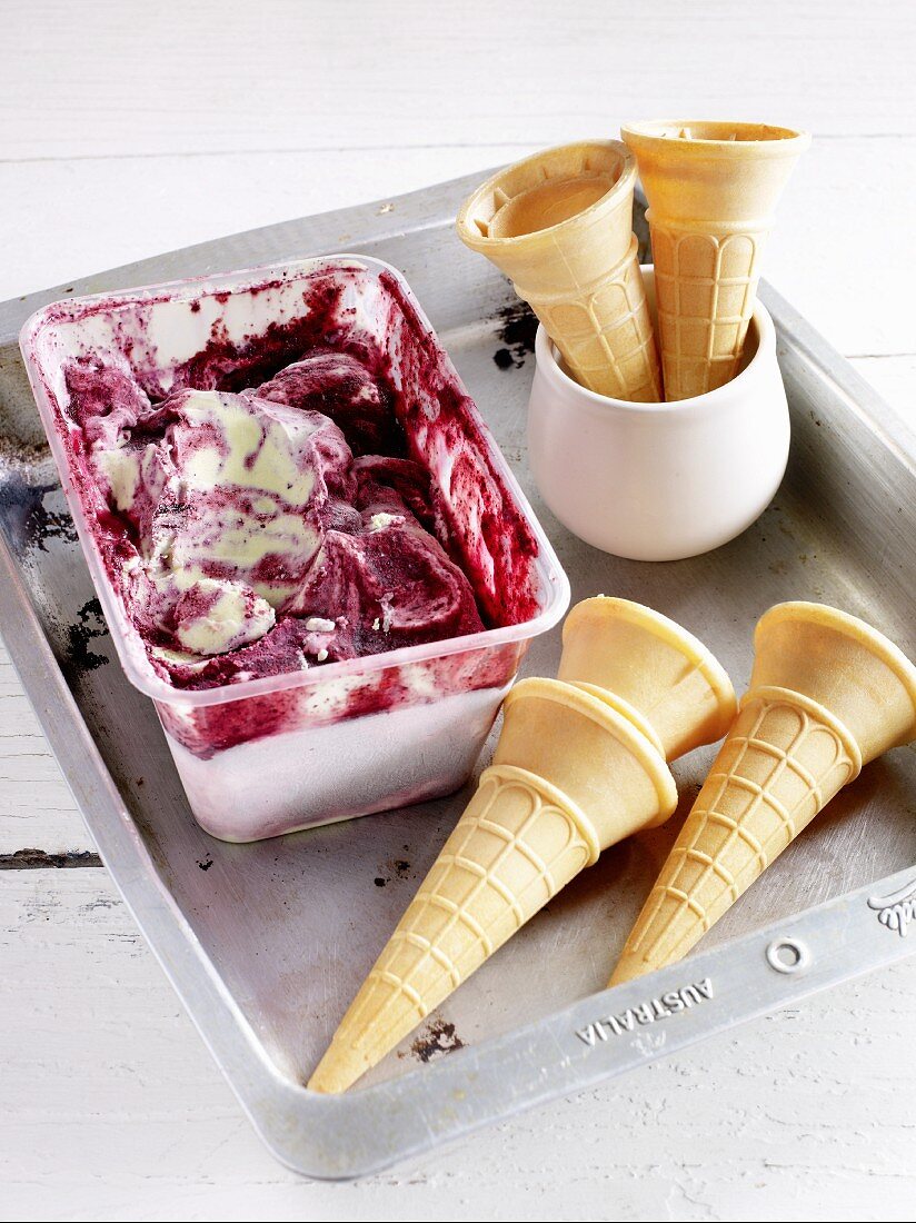 Blueberry and matcha ice cream in a plastic container