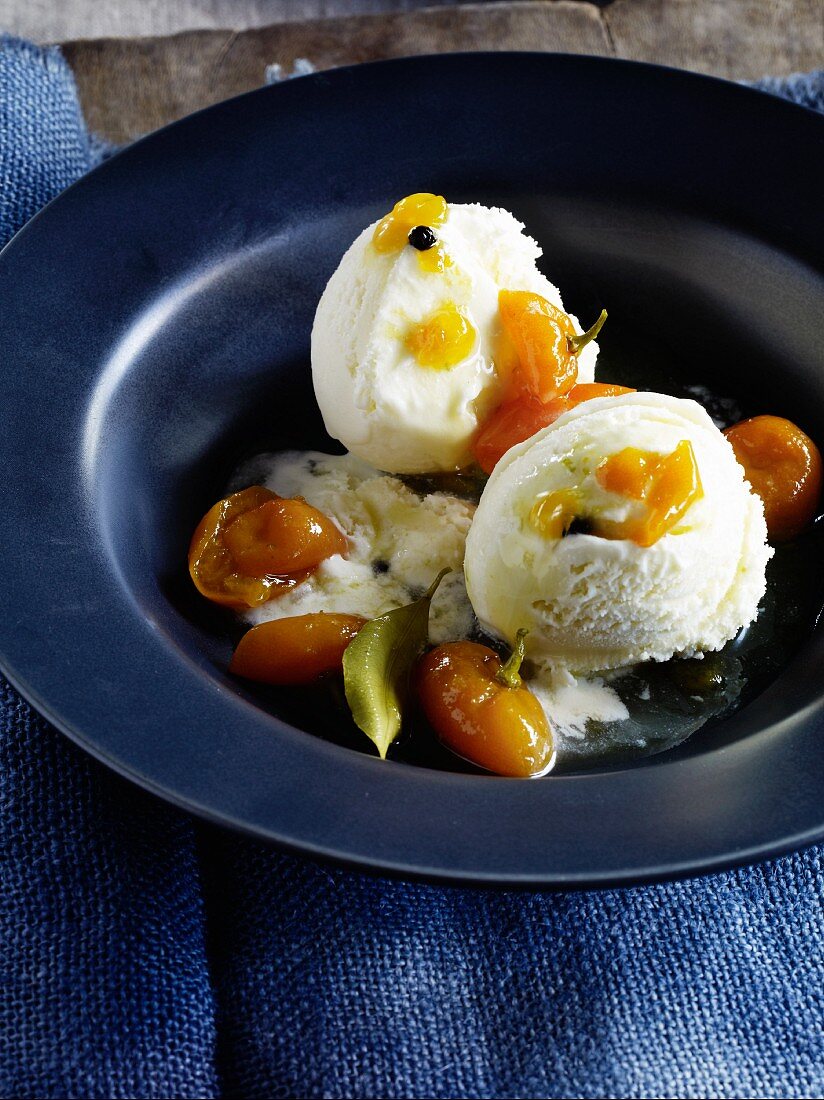 Coconut ice cream with rum and kumquats