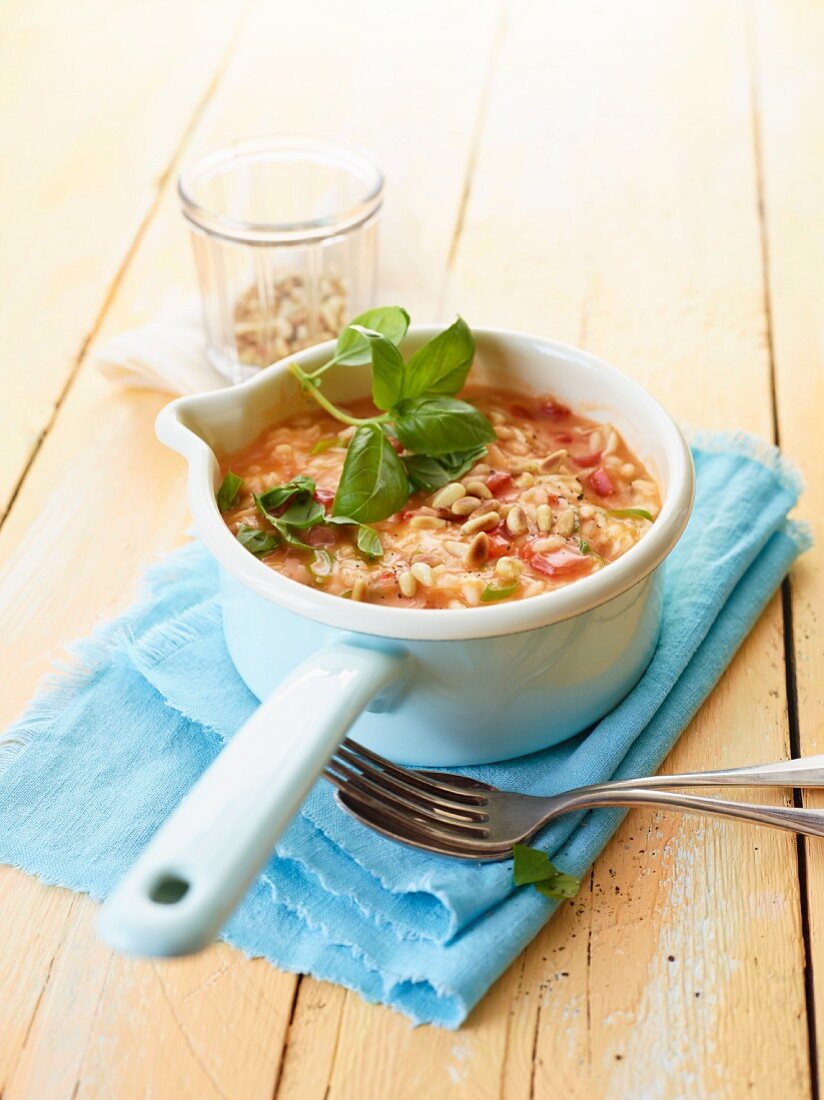 Tomato risotto with pine nuts and basil