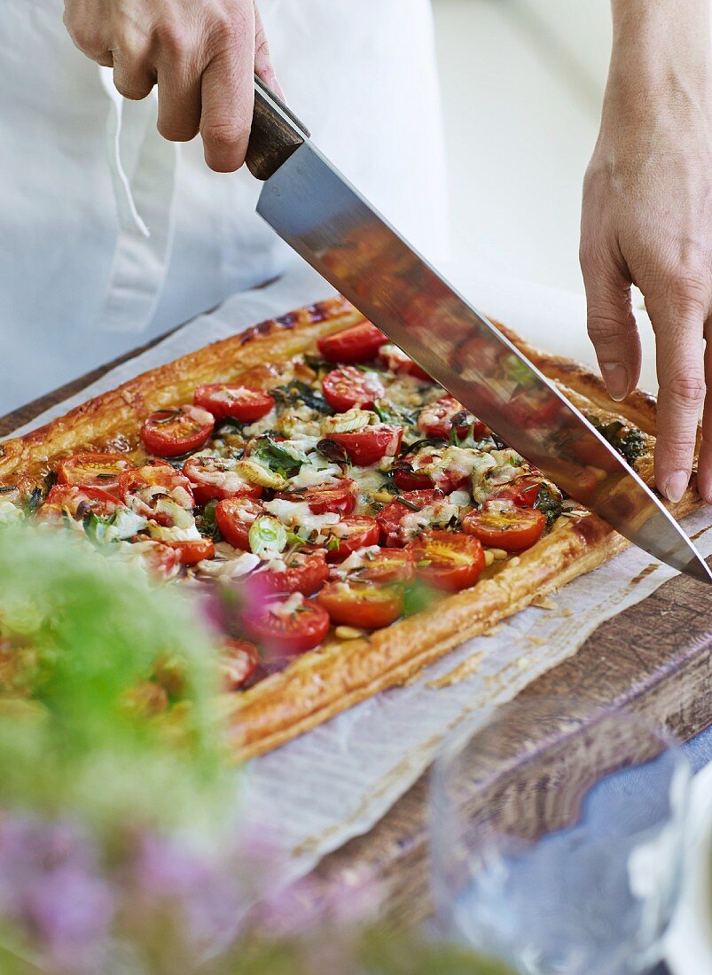 Tomato tart being sliced