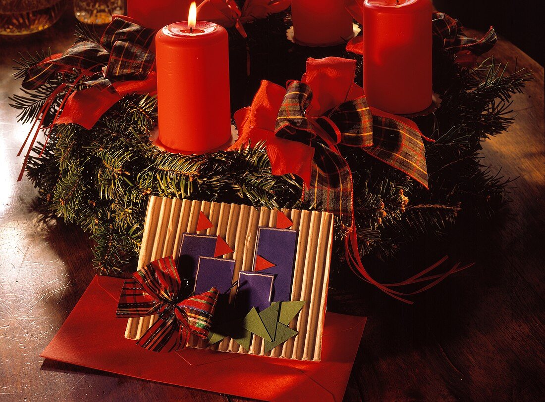 Christmas Wreath with Burning Candles and Invitations