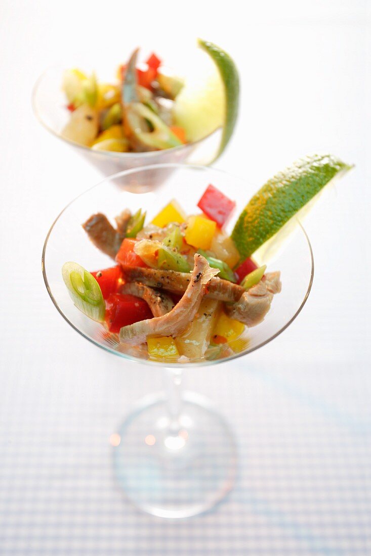 Exotic vegetable salad with turkey served in a cocktail glass