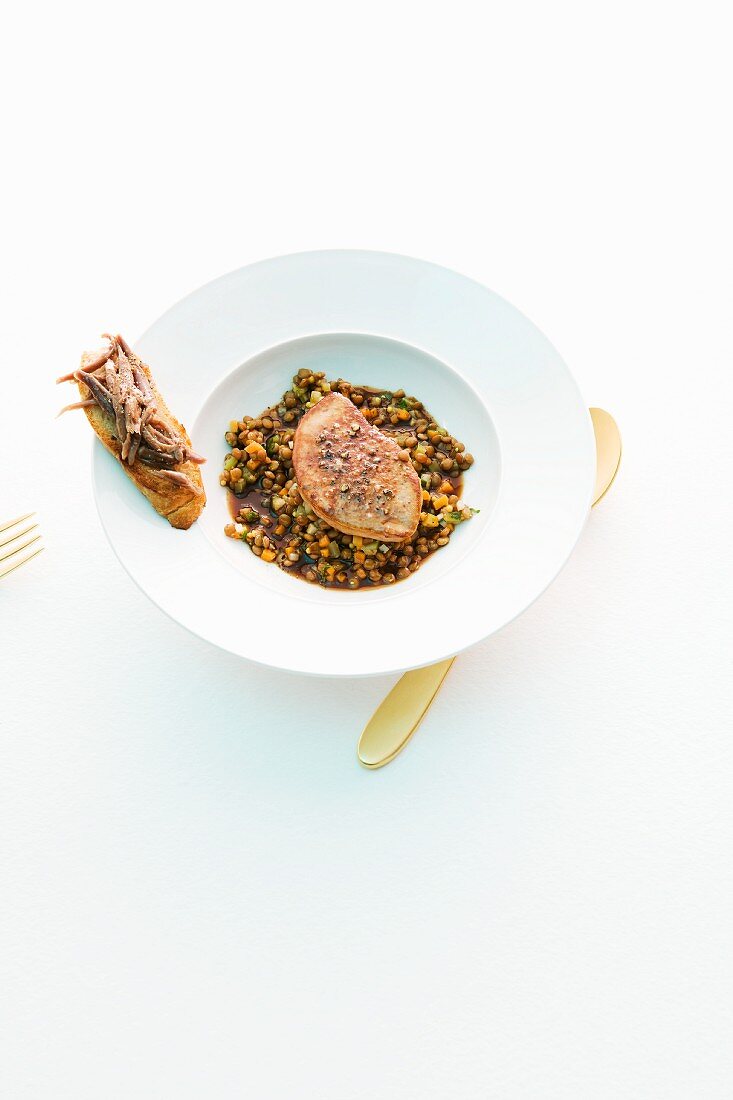 Duck liver on a bed of lentils