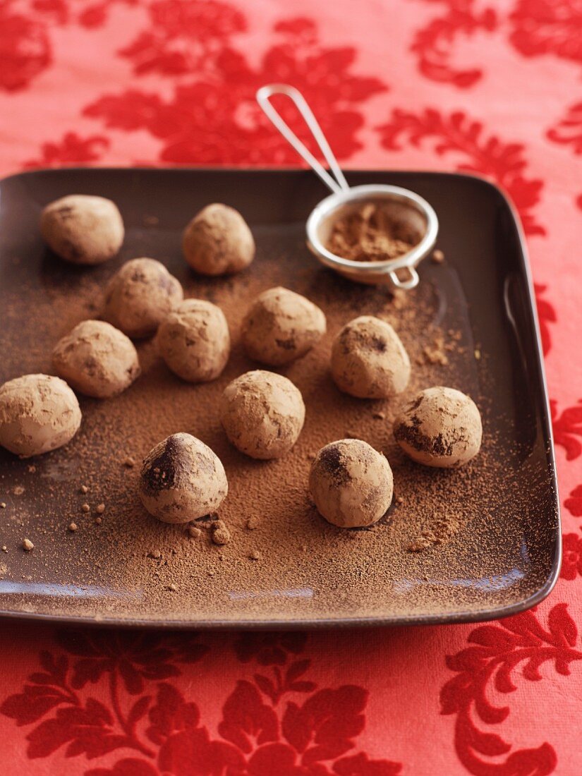 Chocolate and orange truffle pralines with cocoa powder