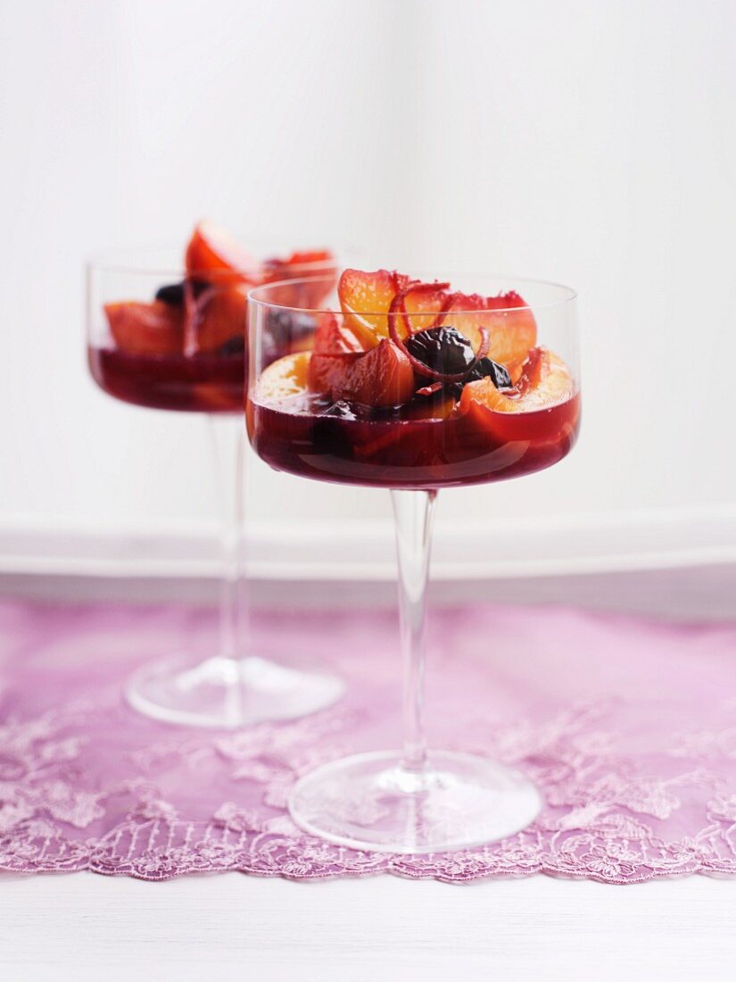 Stone fruit compote in stemmed glasses