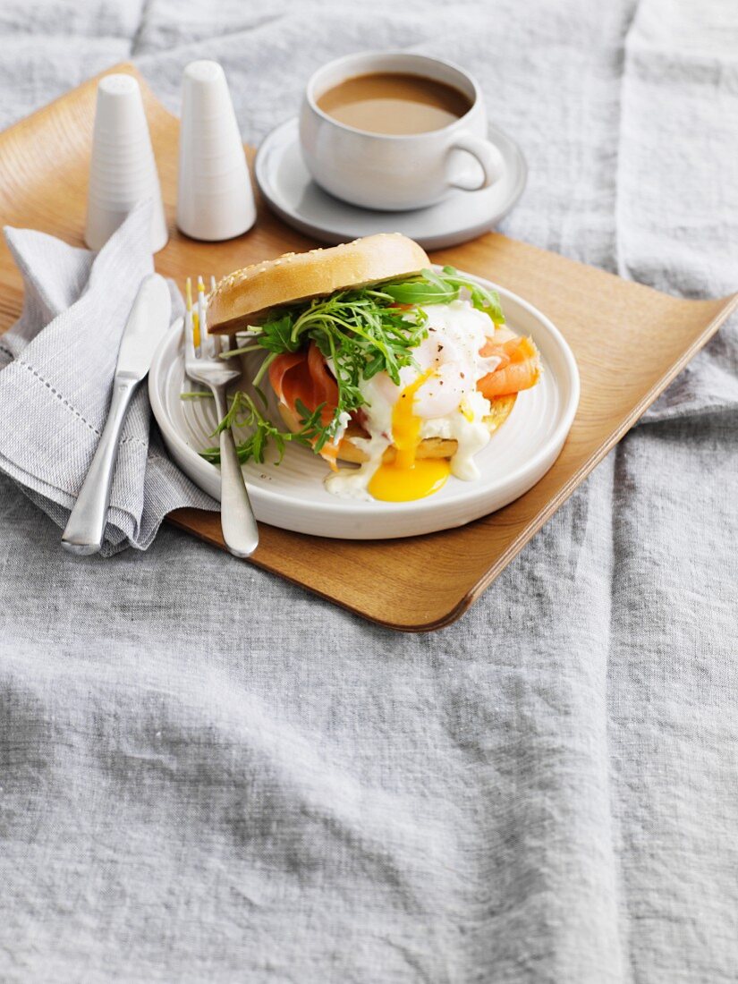 A bagel with smoked trout and a poached egg